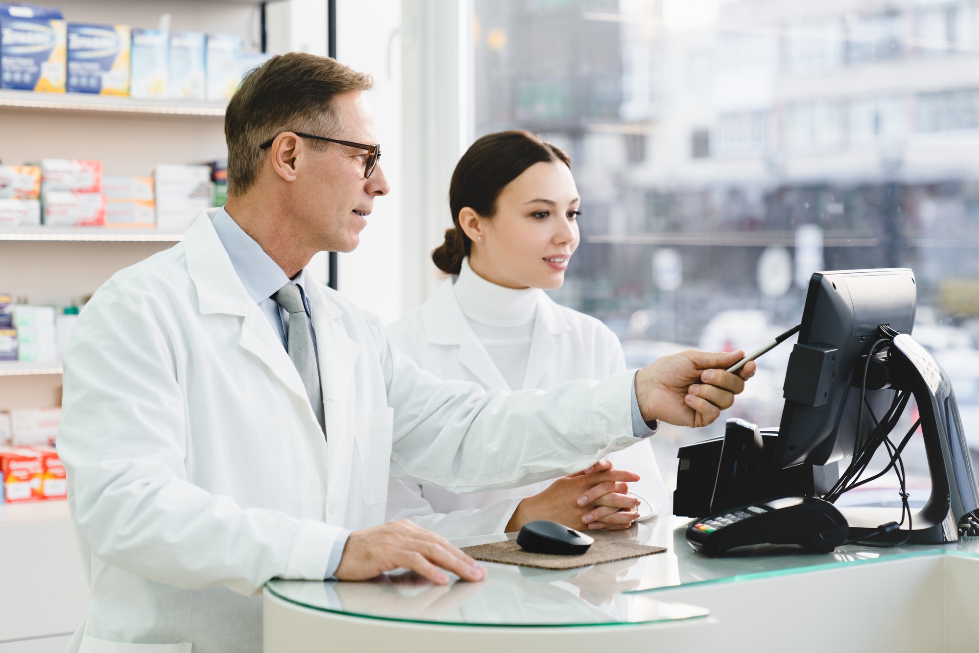 pharmacist-pointing-showing-male-colleague-medication-prices-prescriptions-on-computer-screen.jpg pharmacist-pointing-showing-male-colleague-medication-prices-prescriptions-on-computer-screen.jpg